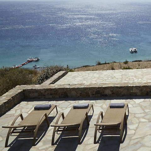 Gaze out at the Aegean Sea from the elevated sun terrace