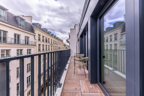 Sip your morning coffee on the private balcony as Paris wakes below