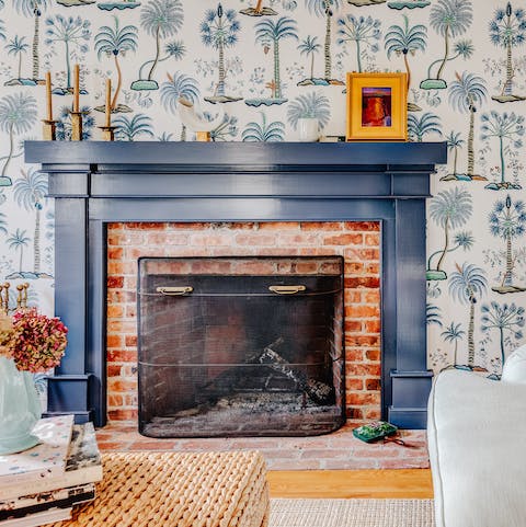 Warm your toes by the cosy brick fireplace