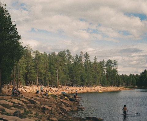 Fish, kayak, or relax beside Fool Hollow Lake's serene pine-fringed shores, a fifteen-minute drive