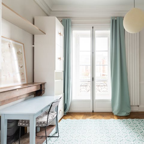 Get some work done at the eggshell blue desk