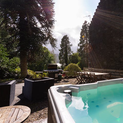 Watch the sunset over the loch from the hot tub