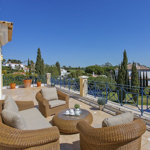 Take in the views of the leafy trees around you from the large balcony