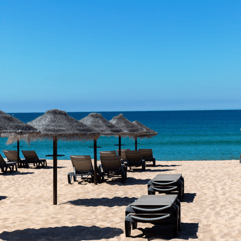 Enjoy lazy days sipping on cocktails and bathing in the sun at Vale do Lobo beach