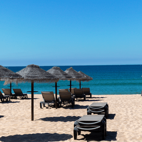 Enjoy lazy days sipping on cocktails and bathing in the sun at Vale do Lobo beach