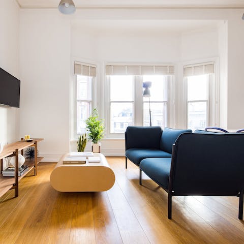 Relax in a home soaked in sunlight from the bay windows