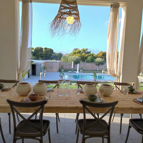 Dine alfresco on the terrace, looking out over the private pool