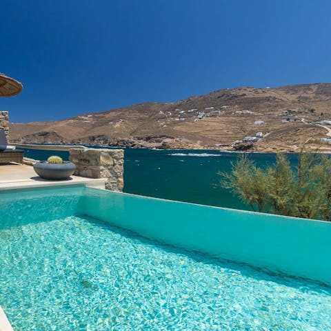 Enjoy views of the Aegean from the edge of your private infinity pool