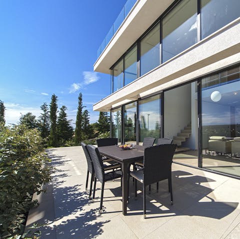 Tuck into delicious Croatian cuisine alfresco on the outdoor dining set