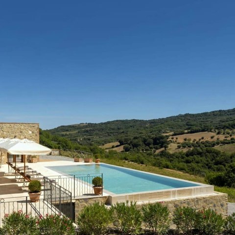 Soak in the pool and admire the countryside views