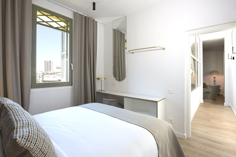 Wake up to open Barcelona skyline through wide windows