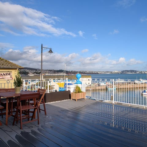Have your morning coffee on the wooden deck and breathe in the sea air