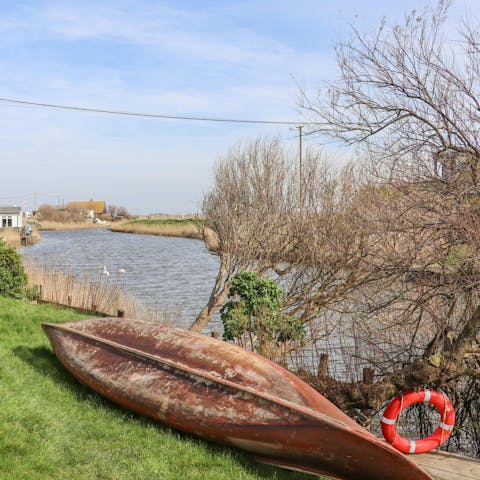 Relax and enjoy the river views from the garden