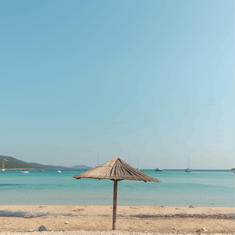 Stroll for ten minutes to Almyros Beach, where you can swim in the Ionian Sea