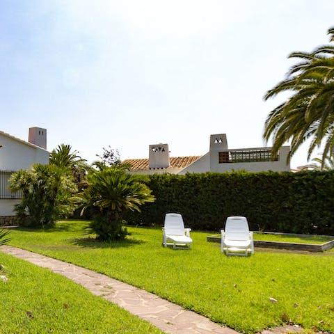 Soak up some vitamin D from the loungers on the lawn