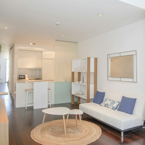 Kick back in the living area with a glass of Portuguese wine after a day of exploring the city
