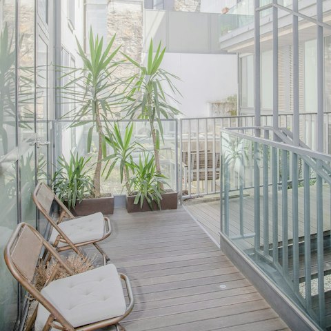 Sip your morning coffee on the communal front balcony
