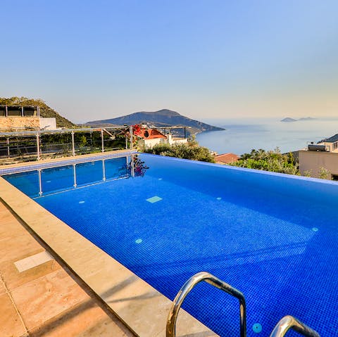 Float in the infinity swimming pool before the spectacular sea views