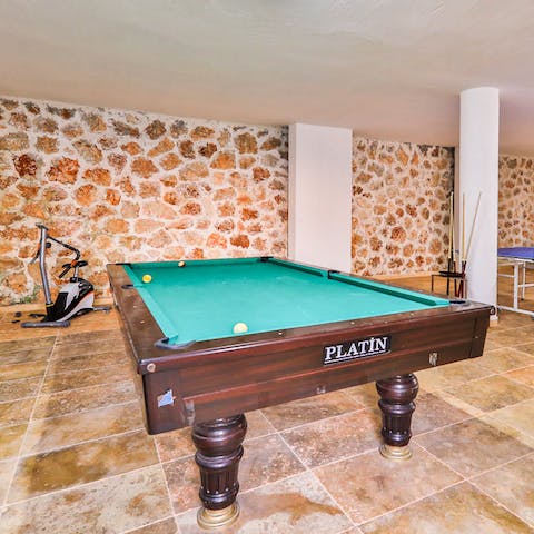 Get competitive over a game of pool with a cocktail in hand