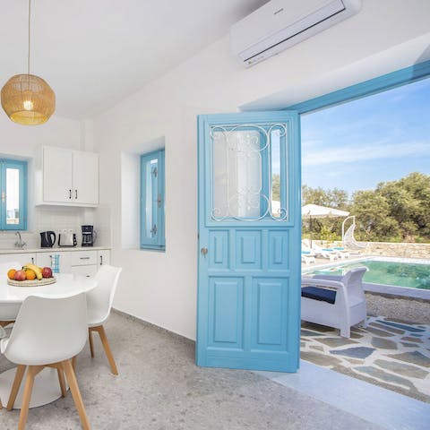 Enjoy indoor-outdoor dining with the open-air design of this traditional Greek home