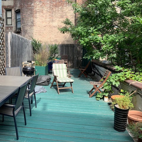 Grill burgers on the barbecue in your little garden