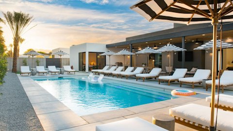 Stretch out poolside as the desert sun drops behind the palms