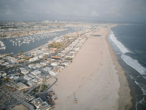 Swim, surf, or sunbathe on Balboa Peninsula's wide Pacific shoreline, a fifteen-minute drive