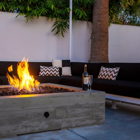 Get cosy with drinks around the fire pit