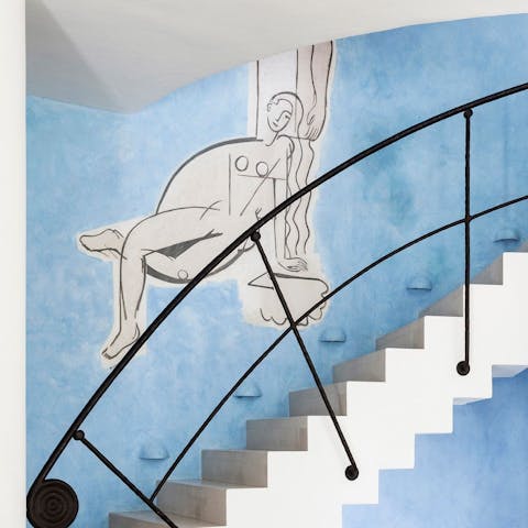 Admire the Pinto-inspired frescoes adorning the walls inside