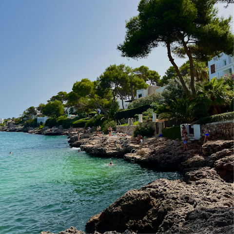 Spend hot days relaxing at Cala Petita, a twenty-minute drive away