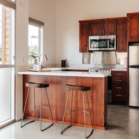 Sip your morning coffee at the breakfast bar before heading to the beach