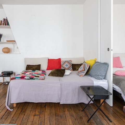 Cosy up on the sofa-bed in the living area and stick a French film on the TV