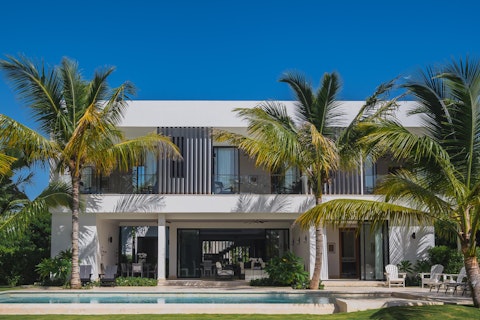 Cool off in the pool surrounded by swaying palms