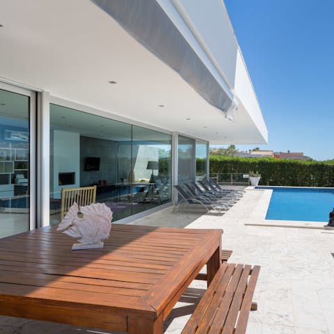 Enjoy meals outdoors by the pool