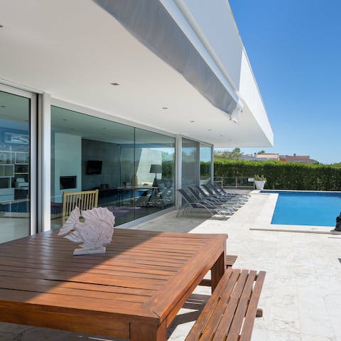 Enjoy meals outdoors by the pool