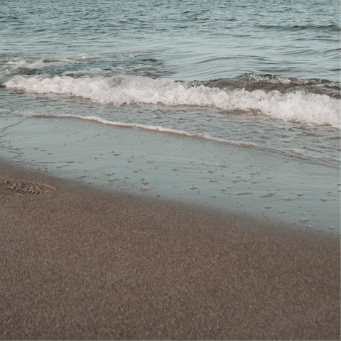 Spend the day on Cala Rossa Beach, a one-minute walk from this home