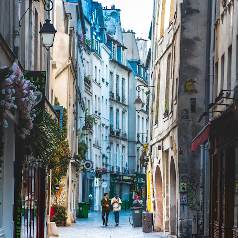 Stay in the City of Light and visit nearby Place des Vosges and Le Marais