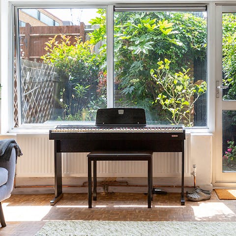 Begin evenings on a jazzy note with a tune on the living room's piano