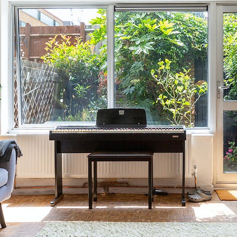 Begin evenings on a jazzy note with a tune on the living room's piano
