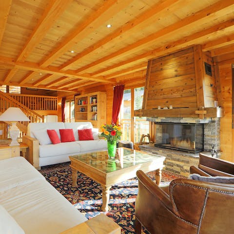 Light the fire and unwind in the cosy living room after a long day on the mountain