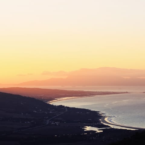 Enjoy a stroll along the sands of Torrox Beach at the golden hour, a short drive from your home