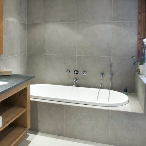 Luxuriate in one of the bath tubs with a glass of Champagne in hand
