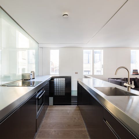 Cook your favourite meals in the sleek, fully-equipped kitchen