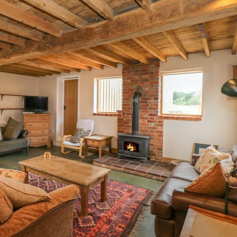 Spend cosy evenings relaxing by the wood burning fire