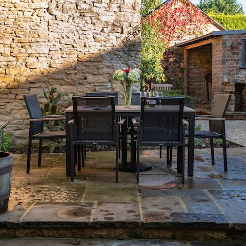 Enjoy an evening glass of Cotswolds dry gin on the terrace