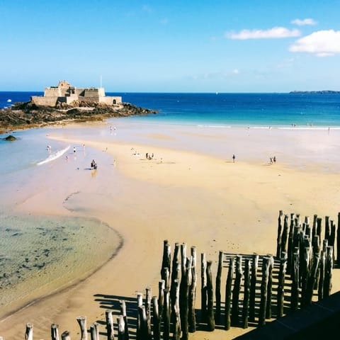 Spend sunny days building sandcastles on Grande Plage du Sillon, a short drive away