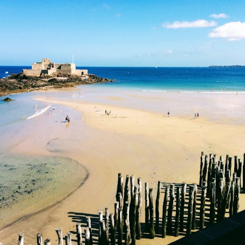 Spend sunny days building sandcastles on Grande Plage du Sillon, a short drive away