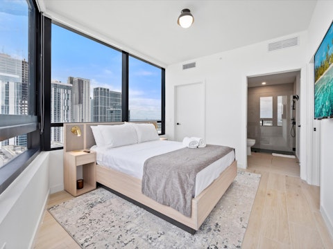 Wake to panoramic Downtown Miami views stretching to the horizon