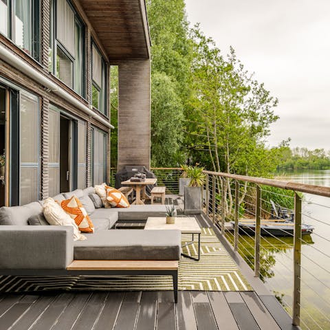 Admire the sunlight dancing on the lake's surface from the terrace
