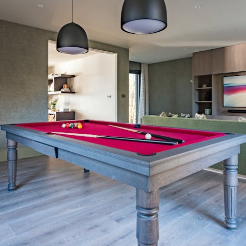 While away rainy afternoons with the assistance of the pool table